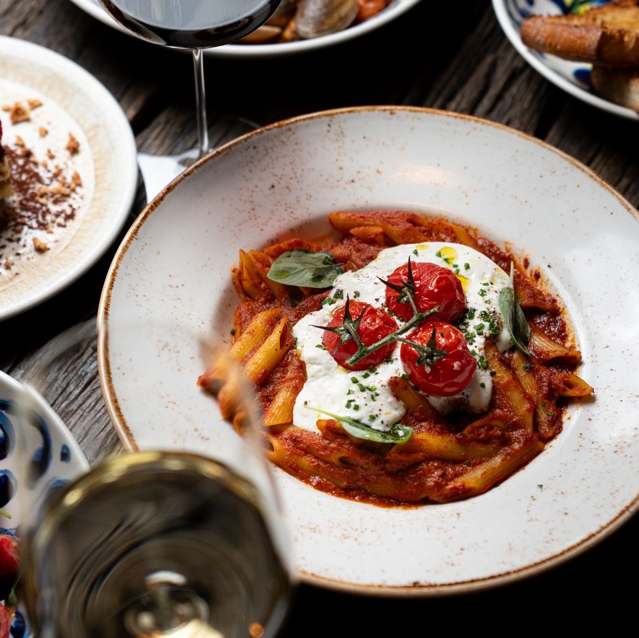 Food and drinks photography for Zafvino: pasta and wine being poured